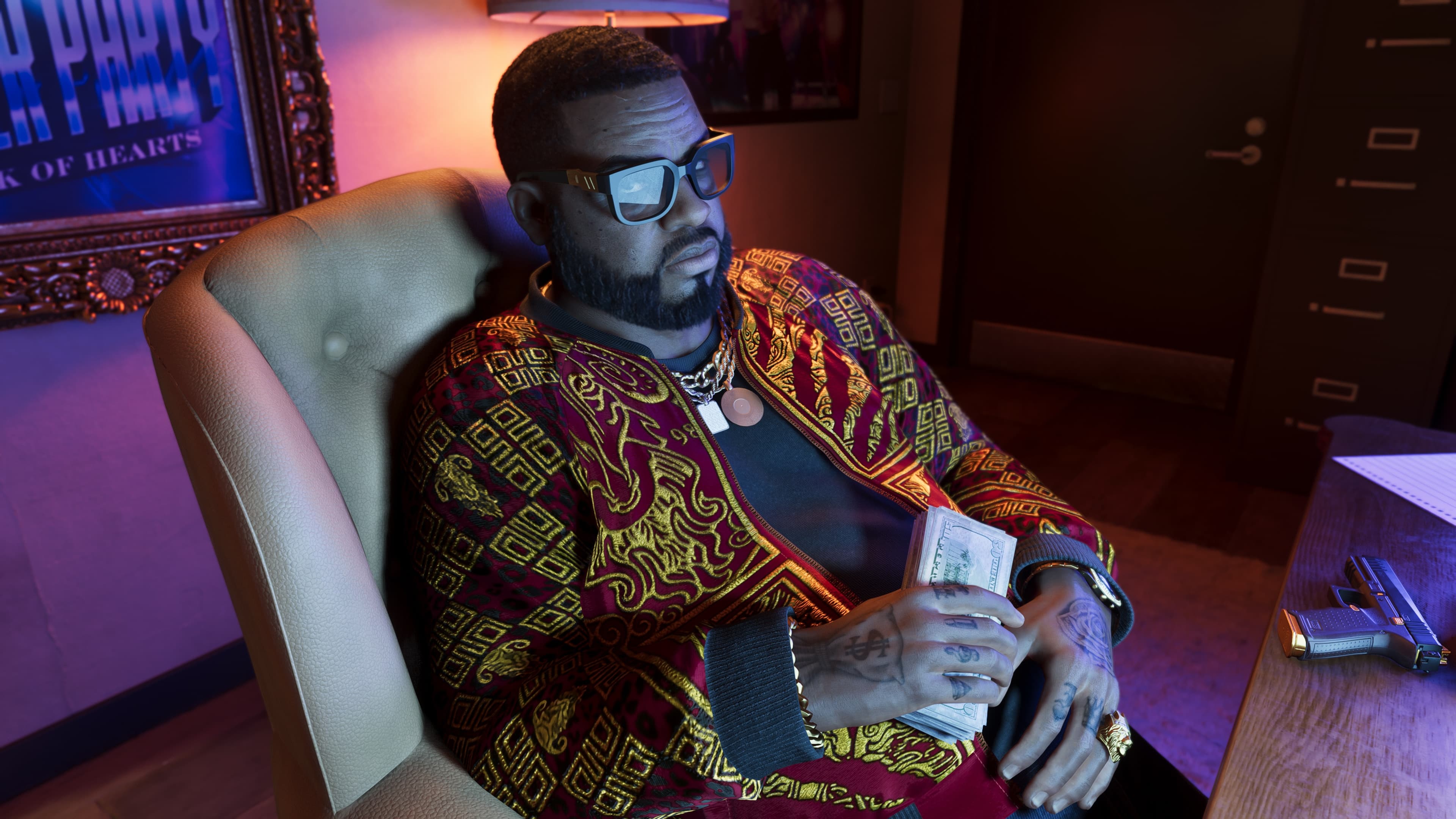Official Rockstar Games render of Boobie Ike — a Vice City legend, depicted in a tinted lit room wearing a patterned silk smoking jacket and gold chain, holding a stack of cash. A framed 'King of Hearts' poster is visible behind him.
