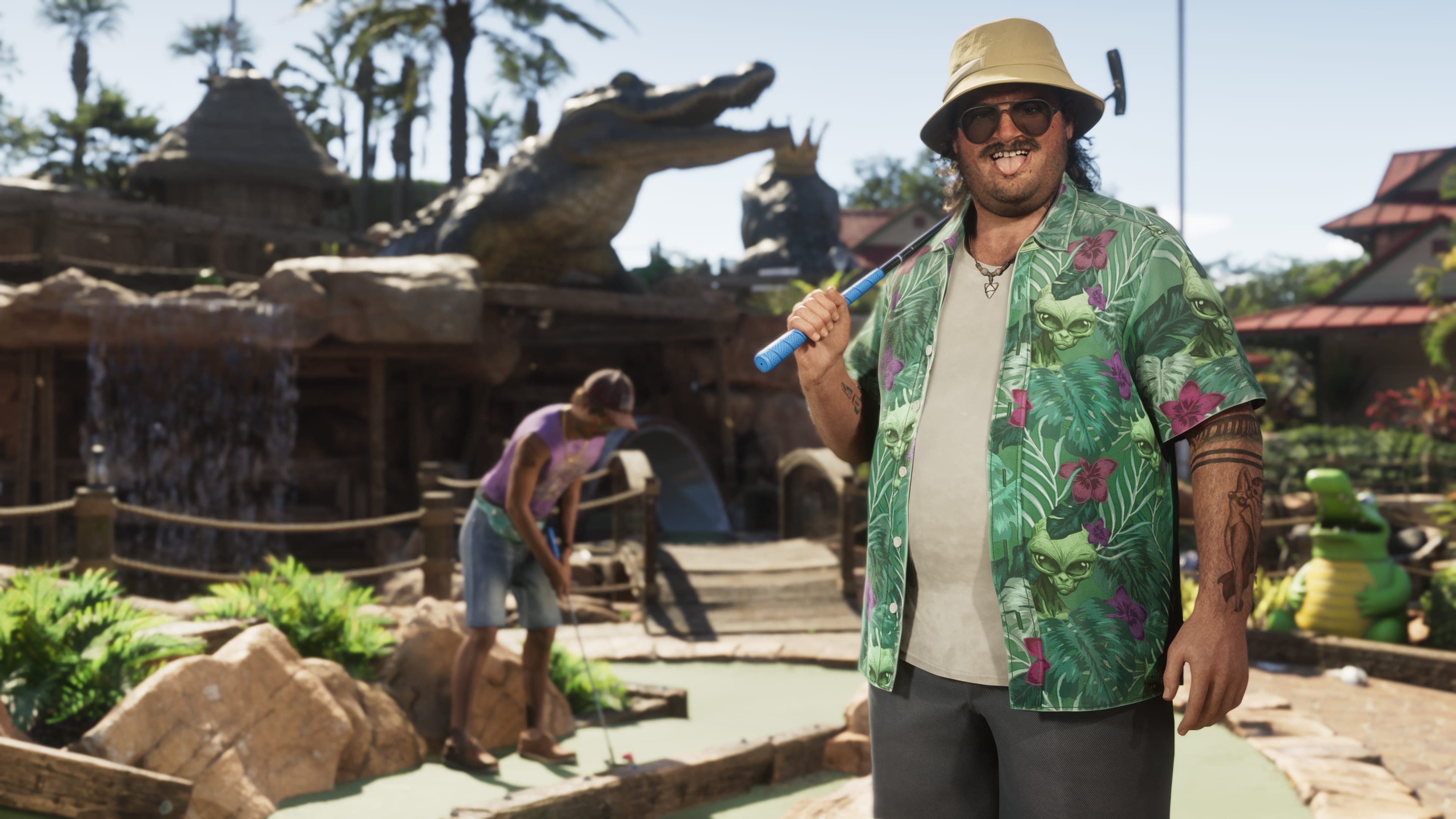 Official Rockstar Games render of Cal Hampton — Jason Duval's friend and Brian Heder's associate, depicted at a tropical mini-golf course with an alligator-statue water feature behind him. He wears a green Hawaiian shirt with cat print and a tan bucket hat.