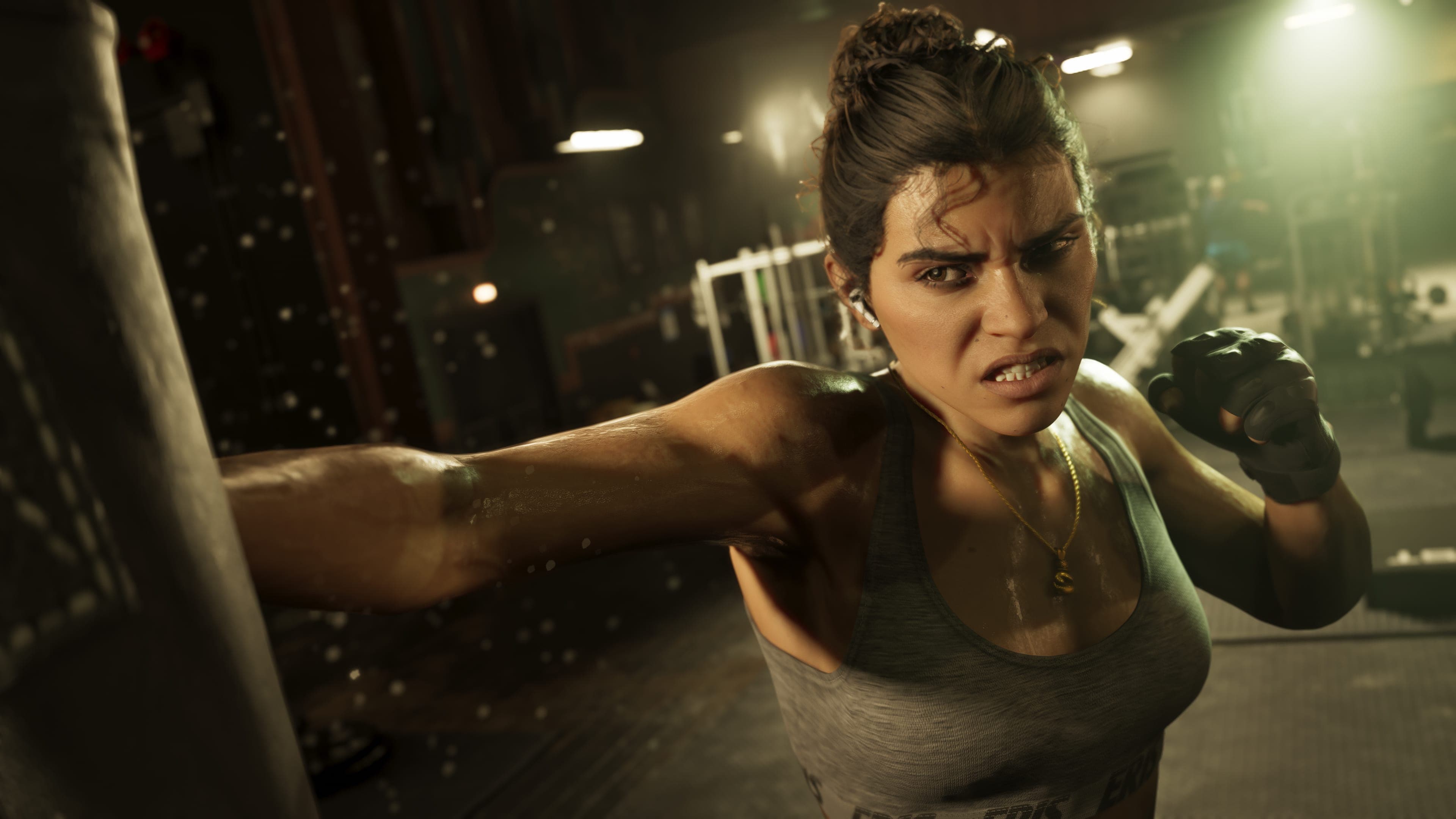 Official Rockstar Games render of Lucia Caminos — co-protagonist of Grand Theft Auto VI and the first woman to lead a GTA title, depicted mid-strike against a heavy bag in a boxing gym.